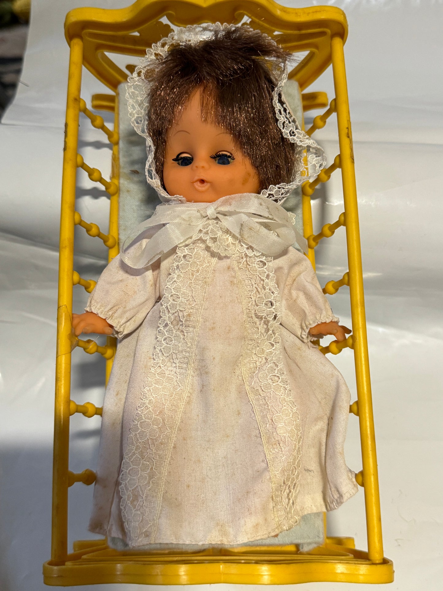 Doll plastic in a Cradle - Vintage