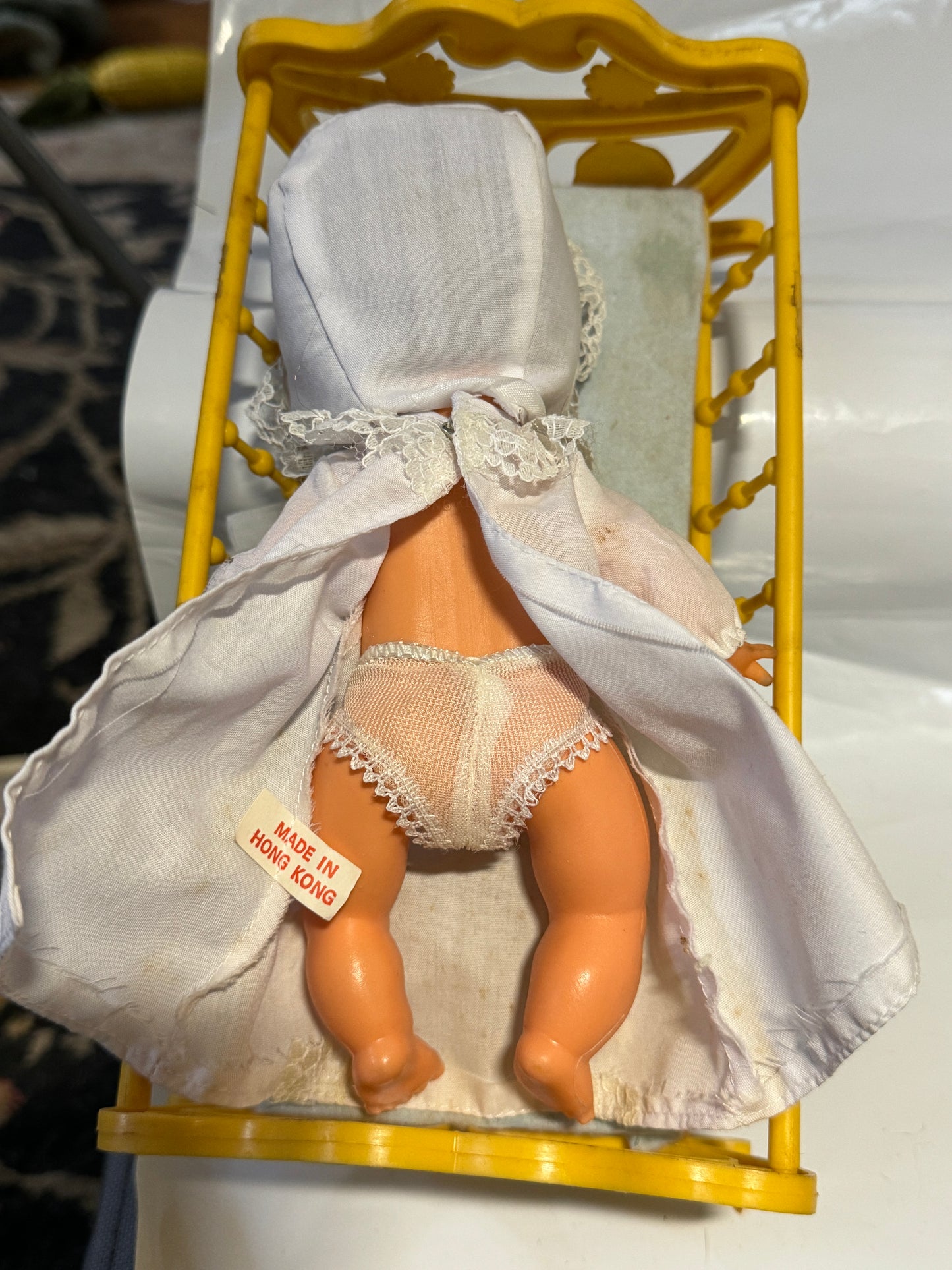 Doll plastic in a Cradle - Vintage